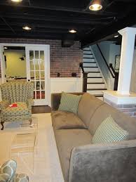 I M Leaning Towards A White Ceiling To Brighten Up The Room But The Black Is Kinda Cool And Hides The Wires A Cozy Basement Basement Remodeling Basement Design