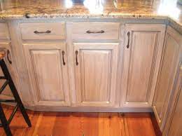 Pickled cabinets, also referred to as whitewashed or the process of staining wood white, are light wood cabinets with a touch of white paint over them that still allow the grain to be seen. Pickled Oak Stained Kitchen Cabinets Oak Kitchen Cabinets Honey Oak Cabinets