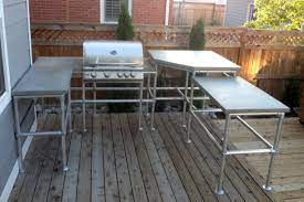 An outdoor kitchen island is an exquisite focal point and a smart storage solution. Custom Outdoor Kitchen Island Simplified Building