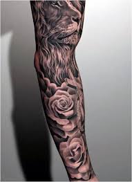 Black And White Sleeve Tattoo For Men Tattoo Black And White Floral With Lion Head Tattoo On Man Full Sleeve Click To See More Tattoos For Guys Men Flower Tattoo Sunflower Tattoo Shoulder