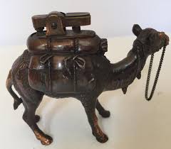 The image and product, there might be some differences such as color. Vintage Standing Camel Sculpture Table Lighter At 1stdibs
