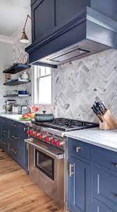 Tile a kitchen backsplash and create an instant focal point. 27 Marble Herringbone Backsplash Marble White Kitchen Navy Kitchen Cabinets Navy Blue Kitchen Cabinets Hale Navy Kitchen Cabinets