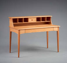 The primary wood is cherry, the side panels and handles. Pompanoosuc Mills