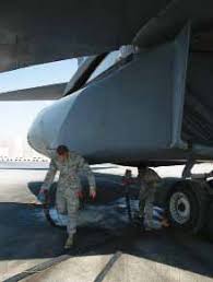 Capt. Eric Cleveringa, deployed from the Air National Guard's 114th Fighter  Wing, Joe Foss Field, Sioux Falls, S.D., signals t