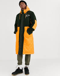 Pour les saisons fraîches, difficile faire l'impasse sur le manteau. Nike Air Parka Matelassee Avec Polaire Orange Kaki Homme