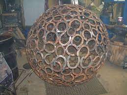 Items Similar To Sphere 48 Inches In Diameter Made From Recycled Horseshoes On Etsy Metal Tree Wall Art Metal Art Welded Scrap Metal Art