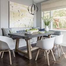 Round Salvaged Wood Dining Table With Gray Bamboo Dining Chairs And White Drum Pendant Transitional Concrete Dining Table Wood Floor Dining Room Dining Nook