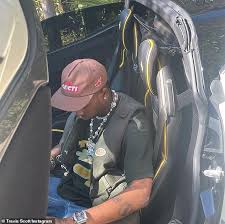No download links for retail music. Travis Scott Dons Olive Green Vest And Light Wash Baggy Jeans As He Leaves Nobu Malibu With Friends Daily Mail Online