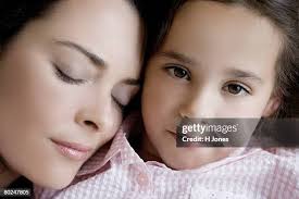 Mother And Daughter Smiling Closeup Portrait High-Res Stock Photo