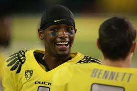 Oregon Ducks defensive end Terrell Turner (left) and running back Kenjon  Barner (right) react during the game against the UCLA Bruins at Autzen  Stadium. Oregon defeated UCLA 60-13. 64579221 Imagem Editorial
