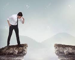 Asian Business Person Looking Down From Top Of The Cliff Stock Photo Picture And Royalty Free Image Image 50400990