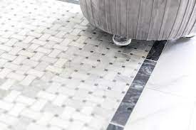 This simple yet practical and adorable design will turn your ordinary bathroom into something one of the most common materials to be used for this pattern is ceramic tiles, but lately many people started to use vinyl flooring, too. Marble Basketweave Bath Floor With Black Marble Border Tiles Transitional Bathroom