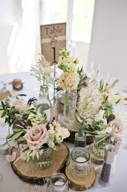 Soft Deconstructed And Rustic Table Centrepieces Ideal For A More Inform Rustic Wedding Table Wedding Ceremony Decorations Outdoor Rustic Wedding Centerpieces