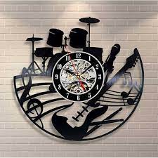 The white face has a brass bezel, black arabic numerals and filigree hour and minute hands. Music Clock Seek Exclusive