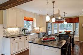 A working kitchen island may include appliances and cabinetry for storage—and it always adds additional work surface to a kitchen. Deco Galley Kitchens Pros Cons And Tips Decor Alert Decoration Idees Inspiration Maison