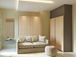 And, it works well with virtually any shade/material of furniture. Queen Size Wall Mounted Bed With Storage And Sofa Homelane