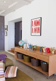 When it comes to storing toys in your living space, you'll want to find the balance between functional and stylish. Amazing Storage Ideas For Toys In The Living Room Easy Ways To Hide Them Living Room Toy Storage Baby Room Storage Living Room Storage