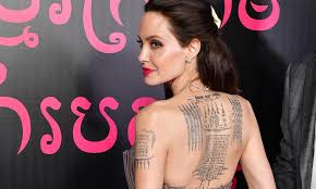 This tattoo is an original sak yant created by ajarn noo kanpai especially for angelina and it was inked ob her back by the. Angelina Jolie S Tattoos What S Their Secret Meaning