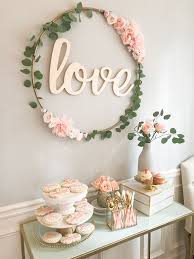 Planning a bridal shower can be stressful, but luckily there are bridal shower ideas to help. Diy Hula Hoop Love Sign Blush And Gold Bridal Shower Decor Bridal Shower Decorations Diy Bridal Shower Diy Gold Bridal Showers