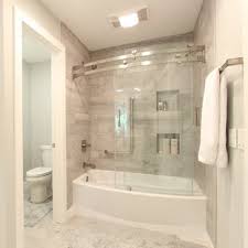 Glass shower panels also bring a seamless look to a space, avoiding the joins and breaks that can make a bathroom look busy and chaotic rather than calm and tranquil. Glass Door Bathtub Ideas Photos Houzz