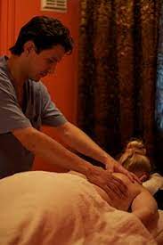 Hot masseuse relieves client's tension. Massage Wikipedia