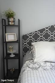 Covering a headboard in fabric is an easy way to make the bedroom look completely different. Remodelaholic Easy No Sew Headboard Slipcover Tutorial