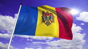 Drapelul moldovei) is a vertical tricolour of blue, yellow, and red, charged with the coat of arms of moldova (an eagle holding a shield charged with an aurochs) on the center bar. Flag Of Moldova With Fabric Stock Footage Video 100 Royalty Free 7103482 Shutterstock