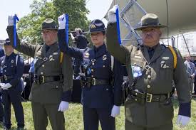 Two U S Border Patrol Agents And A Customs And Border Protection Officer Hold Up Blue Ribbons Signifying Peace Officer Law Enforcement Law Enforcement Officer