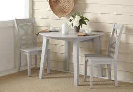 You can store a lot of these tables up against the wall if you have to and for private use, you will probably have it folded out most of the time. Jofran Simplicity Dove Round Drop Leaf Dining Table With Two X Back Side Chairs