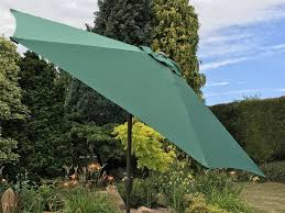 Stay in the shade and enjoy the warm air to take a breather before heading back out to finish off that all important tan. Large 2m Green Crank And Tilt Garden Parasol Umbrella 200cm Metal Pole Uk Gardens Co Uk