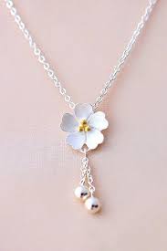 Light Up Your Look With This Adorable Sakura Flower Necklace Dangling Silver Accents Add An Eye Catching Sparkle An Wedding Jewelry Jewelry Beautiful Jewelry