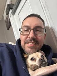 Perry likes his winterwear. He brings it to me and helps by poking his head  and feet in.