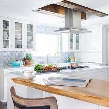 White kuhnhenn kitchen cart with solid wood top. Kitchen Island Gas Cooktop Design Ideas