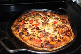 No Knead Pizza Baked On A Lodge Cast Iron Pizza Pan Cast Iron Pizza Pan Knead Bread Recipe Knead Pizza