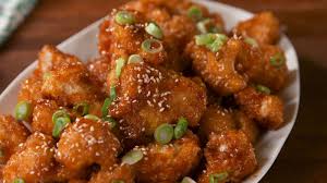 Sweet N Sour Cauliflower Delish Com Sweet And Sour Cauliflower Recipe Recipes Baked Cauliflower