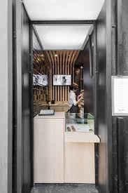 Svelte Coffee Shop Slots By Boscardin Corsi Between Two Stores In Brazil Small Coffee Shop Coffee Shops Interior Cafe Interior Design