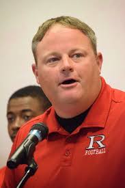 Justin Newcomb, right, is the new coach at Cousino…