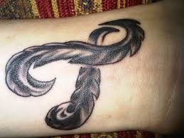 Sunflower cancer ribbon tattoo a great way of going about a cancer ribbon tattoo is to incorporate it with another bright and vivid element. Cancer Ribbon Tattoos Design Press Designs With Images