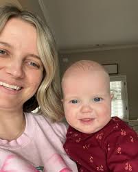 Emma Grace is half a year old 🥳 She weighs 19.5 lbs (92nd percentile) 💪🏼  She's 27 inches tall (89th percentile) 📏 She loves her feet, her brother,  and baths. 👣 🛁