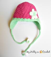 Alternating blocks accented with appliques of beehives and bumblebees creates an adorable baby blanket guarenteed to make any baby bee happy. My Hobby Is Crochet Blooming Berry Earflap Baby Hat Free Crochet Pattern