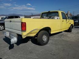 Image result for Bright Yellow 1990 Truck