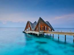 This renovated bungalow kitchen went with clean white cabinetry with gold hardware, white subway tile backsplash and wood open shelving. Joali Maldives Art Resort Inspired By Her The Feminine Spirit Of The Brand Archi Living Com