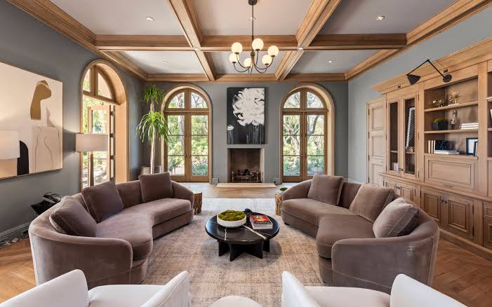 Warm wood-beam living salon inside Drake's Beverly Hills estate, AI generated