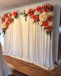 Budget anywhere from $80 to $400 for guest table centerpieces, dependent on the number of tables, types of flowers included, and other factors. 40 Beautiful Paper Flower Wedding Backdrop Ideas Flower Backdrop Wedding Paper Flower Backdrop Wedding Flower Wall Wedding