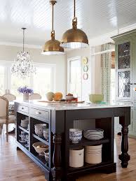 A kitchen island is a great functional piece for cooking, peeling, washing and even having meals a mobile industrial kitchen island of metal and wood with two shelves and hooks and holders for an. Kitchen Island Storage Ideas Better Homes Gardens