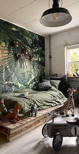 Take your little boy's bedroom to the wild side with a jungle themed bedroom. Kids Safari Bedroom Jungle Safari Bedding Room Decor In 2021 Kids Jungle Room Kids Room Wallpaper Baby Room Design