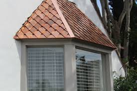 Neither shakes nor shingles should have a waterproof underlayment installed unless the shakes or shingles are installed on a batten system, which both shakes and shingles have minimum slope requirements. Diamond Shingle Bay Window Roof Copper Roof House House Roof Metal Roof Houses