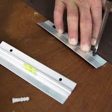 Mark 2 spots about 6 inches (15.24 cm) from the top on either side of the center of the back of the mirror. How To Hang Heavy Mirrors
