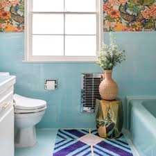This makes an impression of a beautiful koi fish augmented by the few accents of gold on the bathroom fixtures that stands out against the glass and white elements. Blue Bathrooms Apartment Therapy