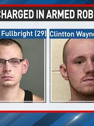 Charges filed against two males in connection to May armed robbery